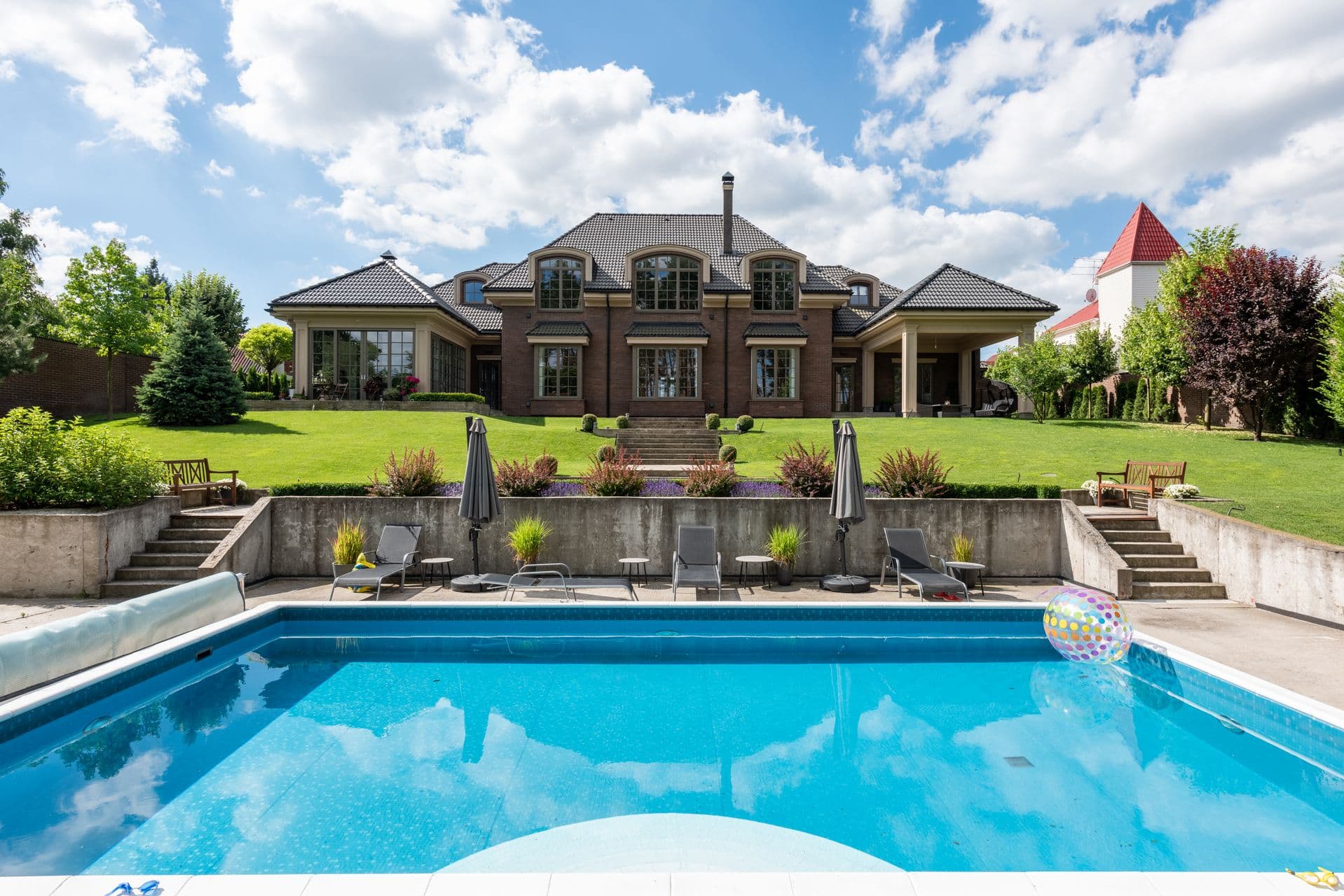 Luxury backyard with pool and outdoor dining